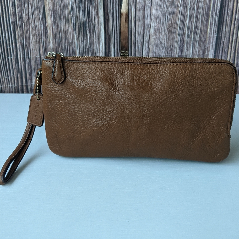 Coach Double Zip Wristlet in brown leather.